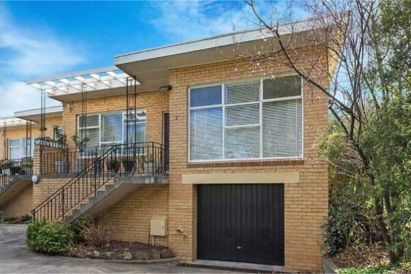 Charming brick house with elevated entry and garage in Surrey Hills VIC 3127.